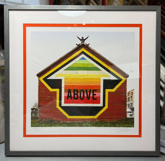 Framed mural print “Above” with white and orange mats, Steel Steampunk frame, and Conservation Glass.