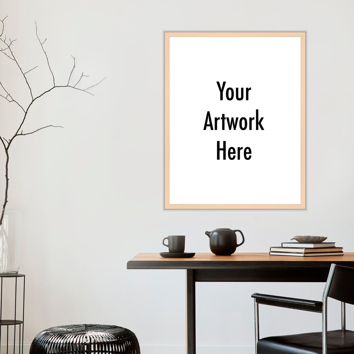 Framed artwork with 'Your Artwork Here' text on a wall above a wooden table.