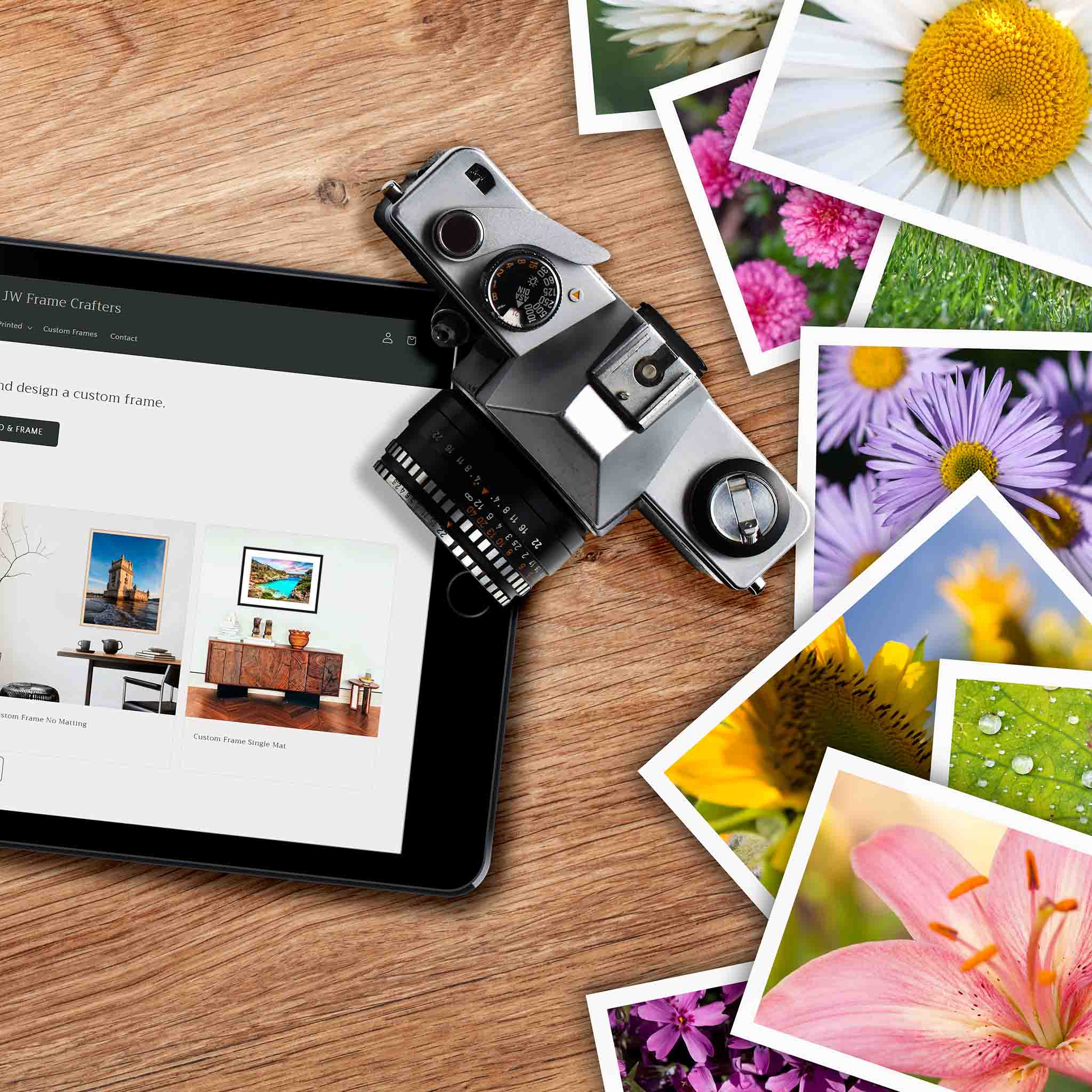 Tablet displaying a website with a vintage camera and flower images on a wooden surface