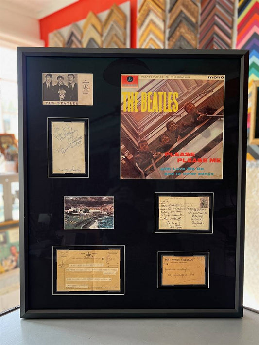 Beatles memorabilia shadowbox with signed letters, telegrams, and Please Please Me album cover framed in Larson Soho Black with Museum Glass.