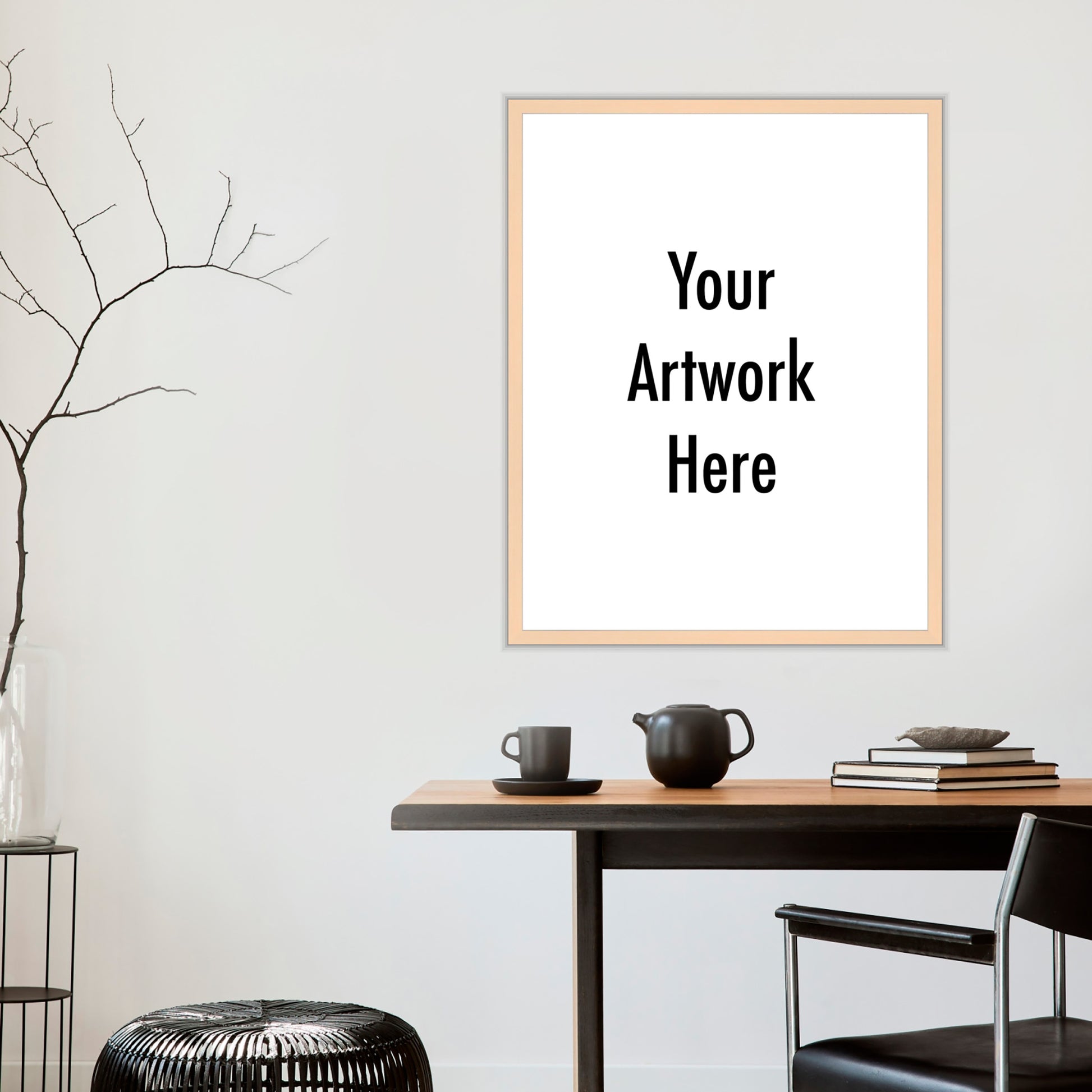Framed artwork with 'Your Artwork Here' text on a wall above a wooden table.