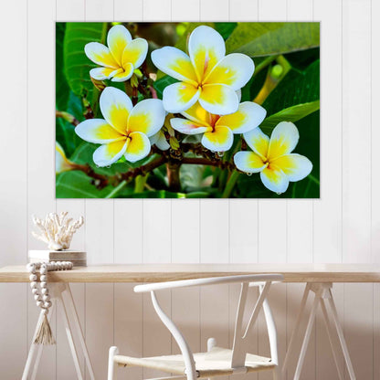Floral painting on a wall above a wooden table with a chair.