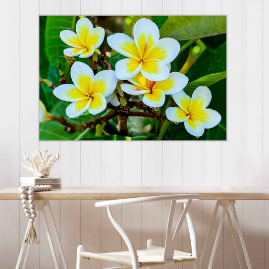 Floral painting on a wall above a wooden table with a chair.
